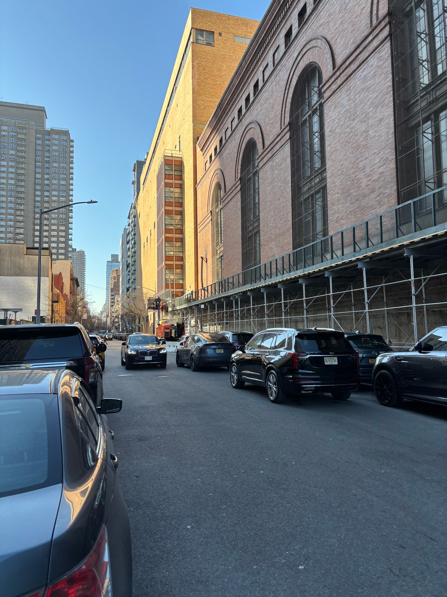 Sidewalk shed with mesh panels on a New York City street