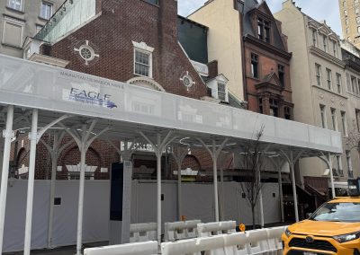 beautiful sidewalk shed by urban umbrella with Eagle Scaffolding logo