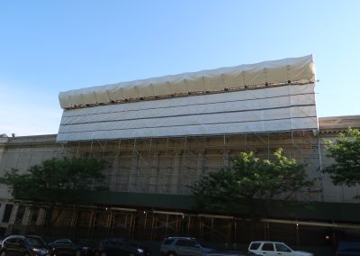 sidewalk shed and systems scaffolding on building face